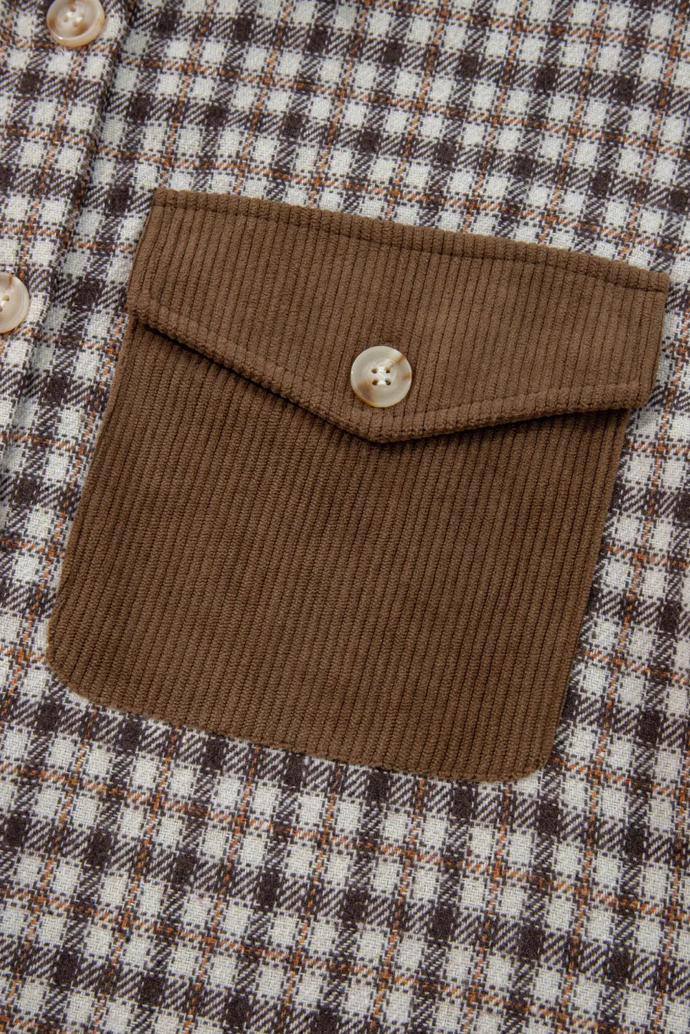Brown textured pocket on a checkered fabric background