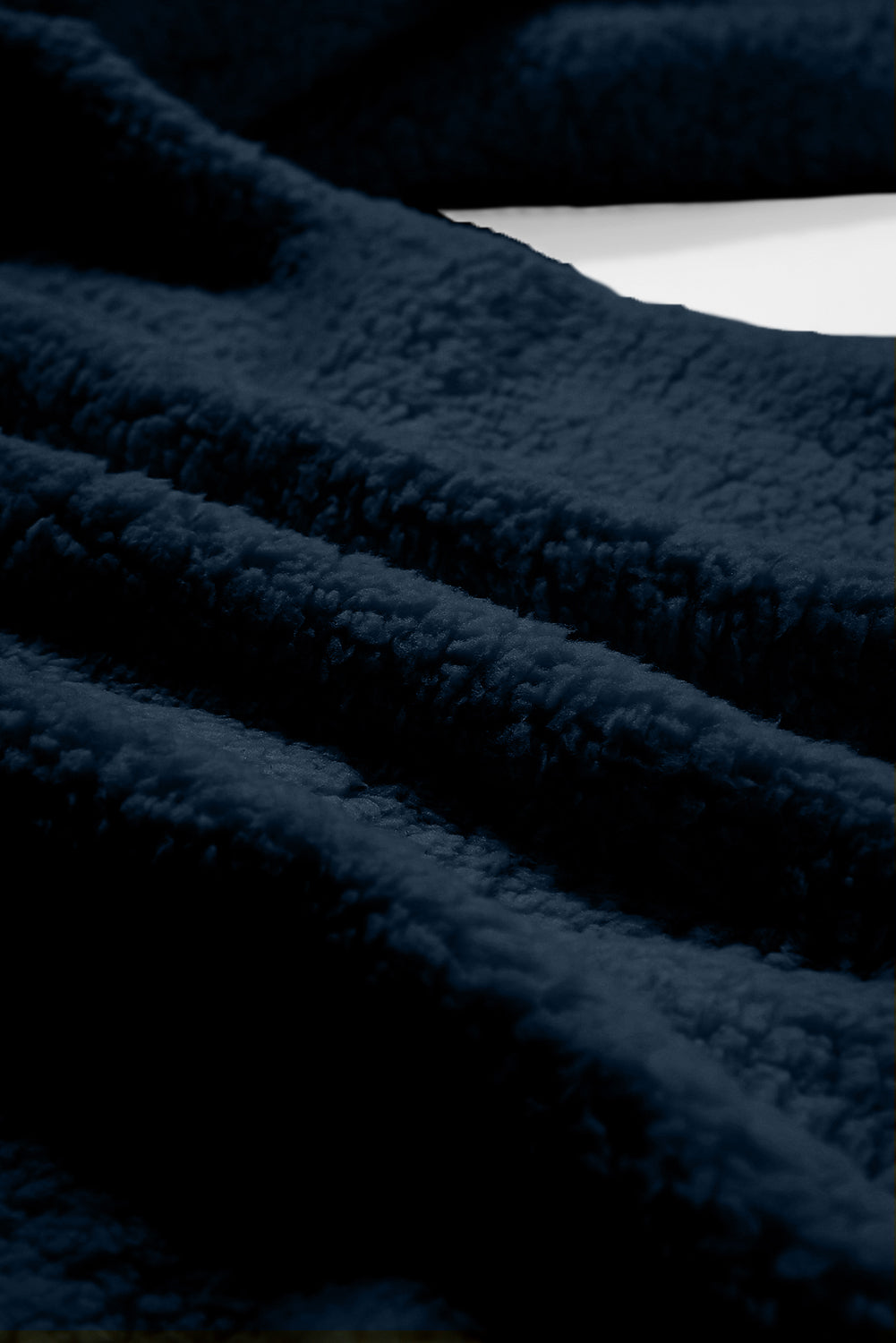 Close-up of dark blue fabric texture.
