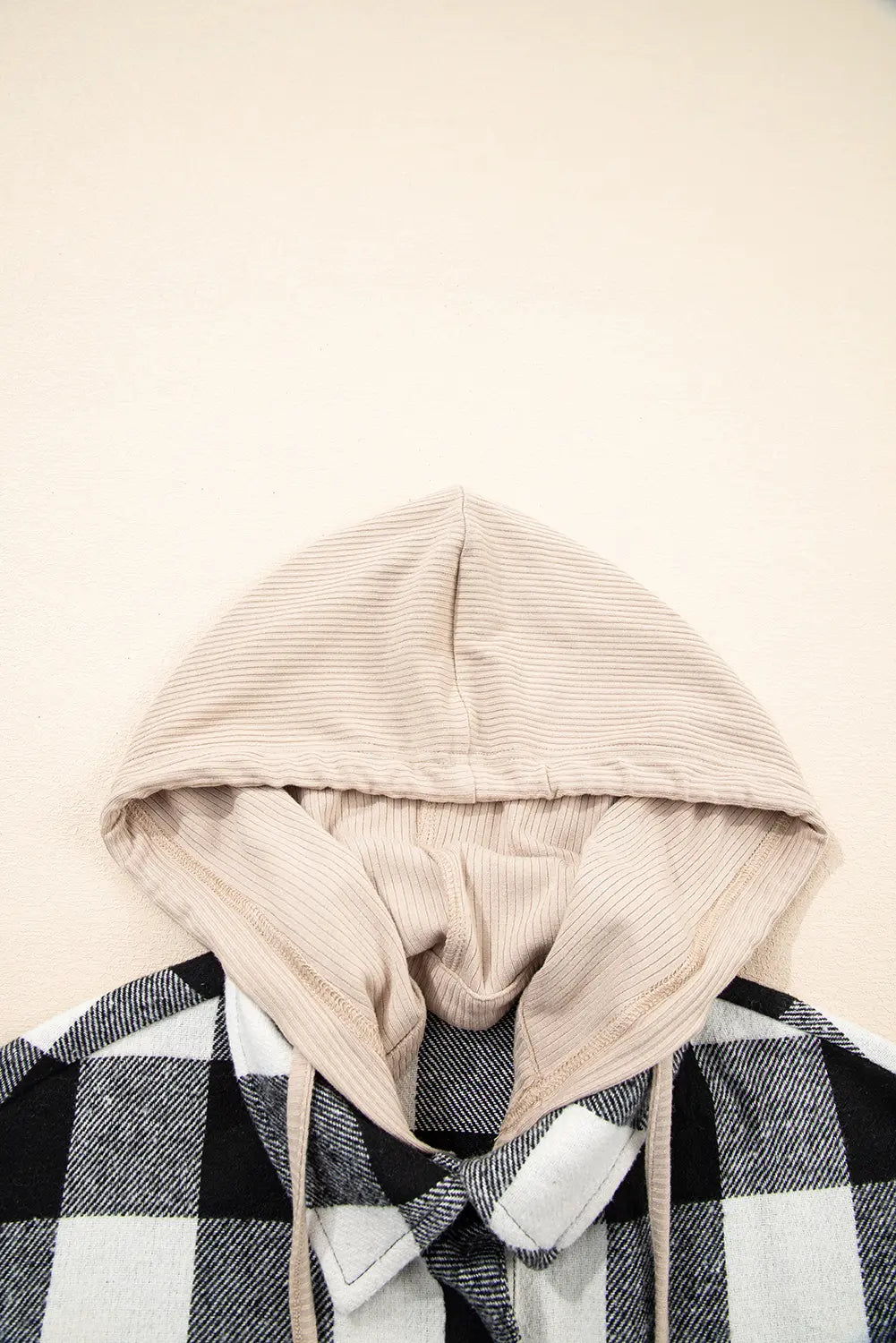 Hoodie with a checkered pattern on a beige background