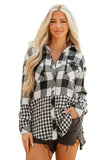 A blonde woman modeling a black and white buffalo plaid button-up shirt with a mixed pattern design, paired with dark denim shorts, against a plain white background.