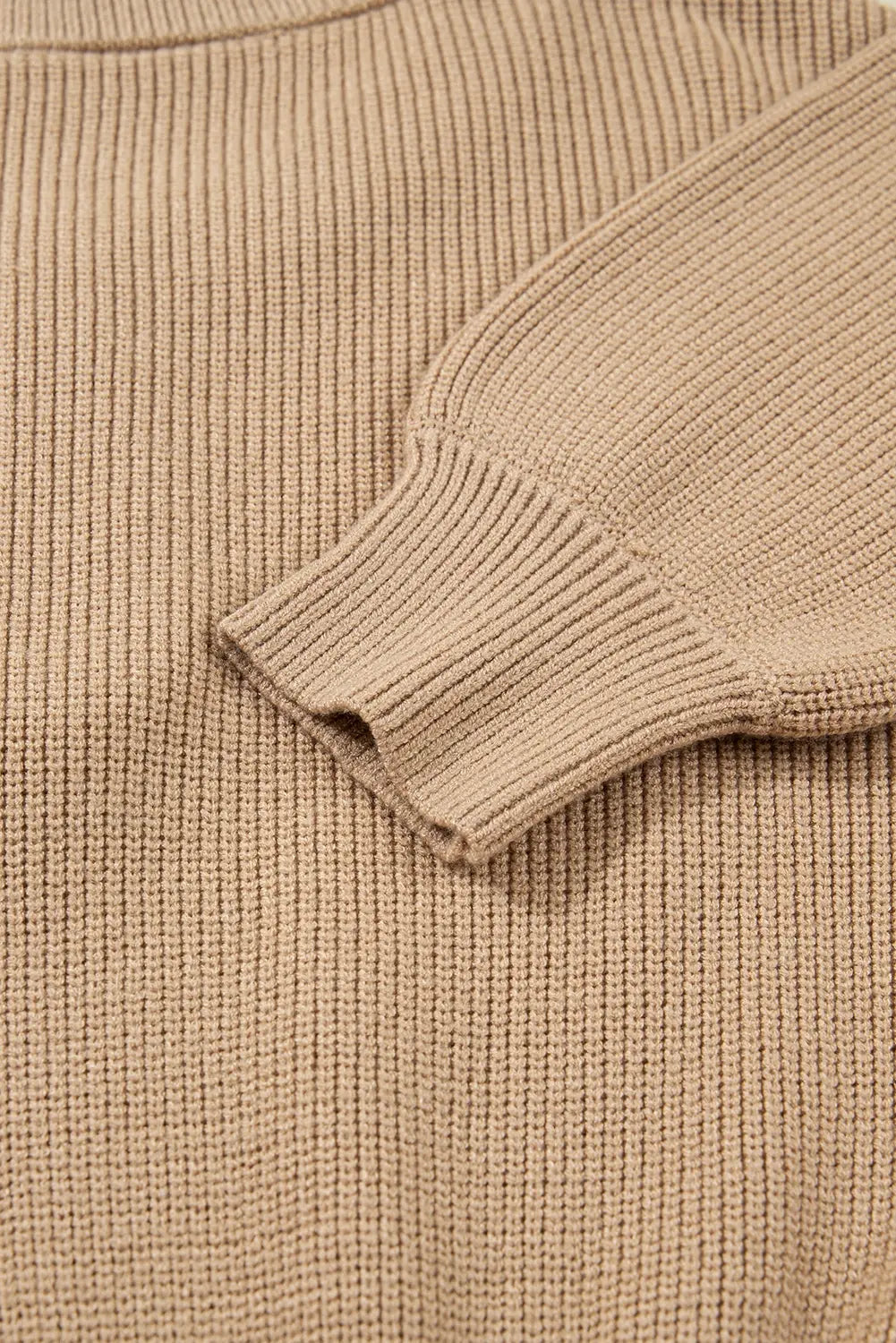 Close-up of a beige knitted sweater sleeve