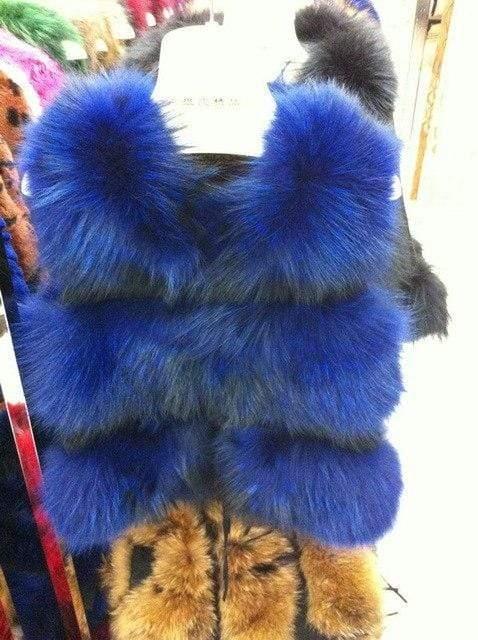 Blue fur vest with a white label on a mannequin against a colorful background