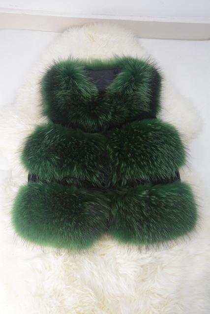Green fur vest on a white fluffy surface