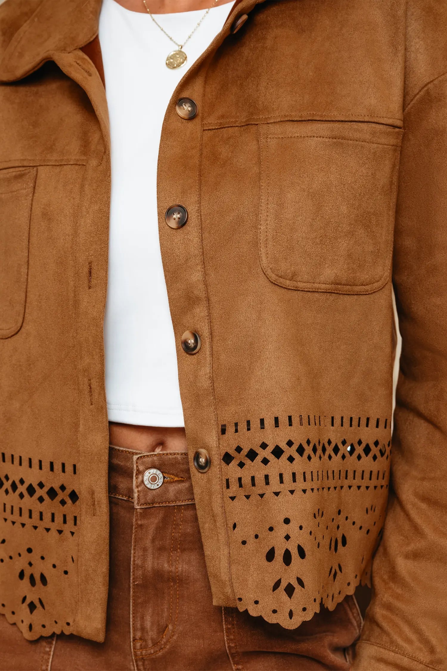 Brown suede jacket with cut-out details on a white background