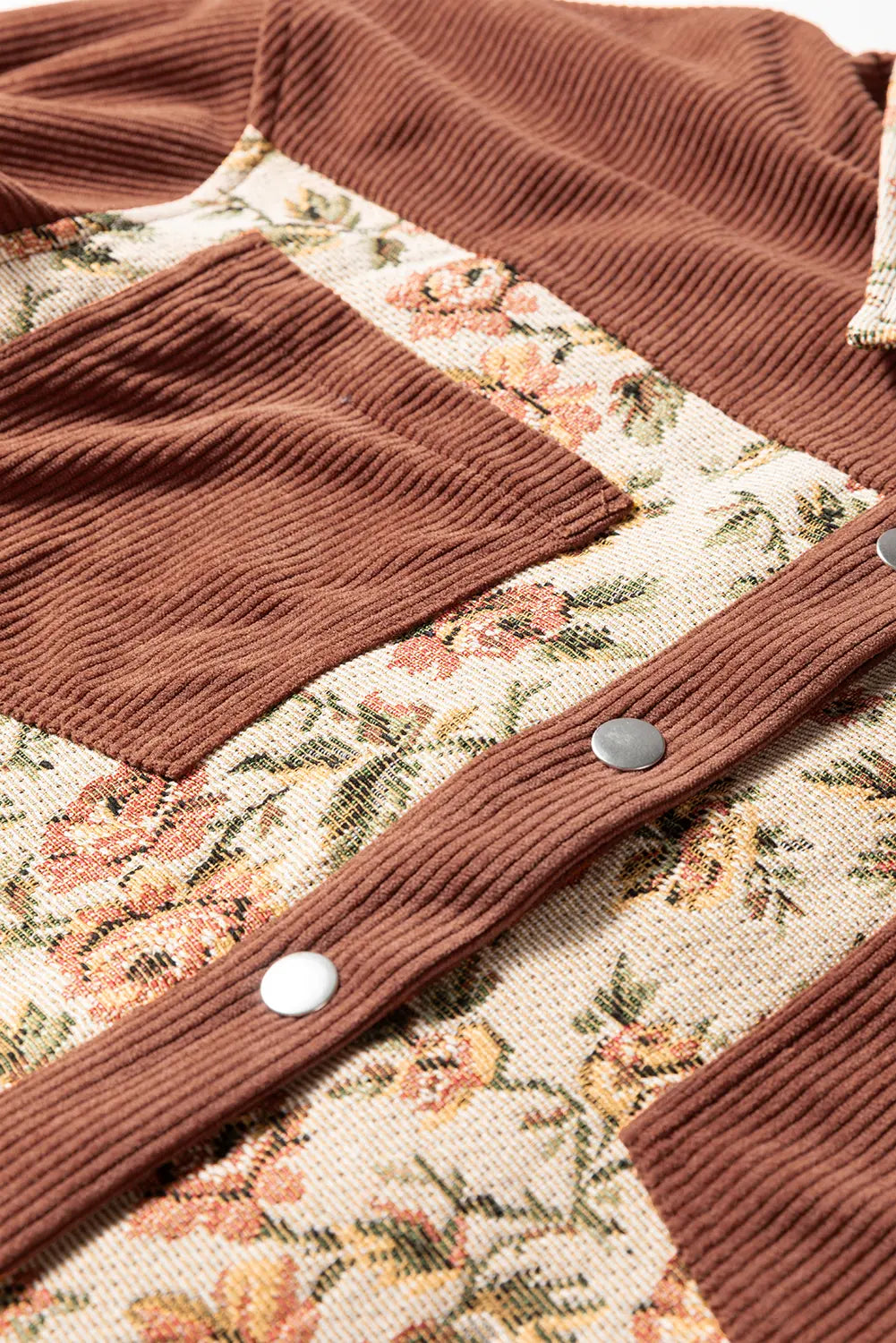 Brown textured fabric with floral pattern in the background