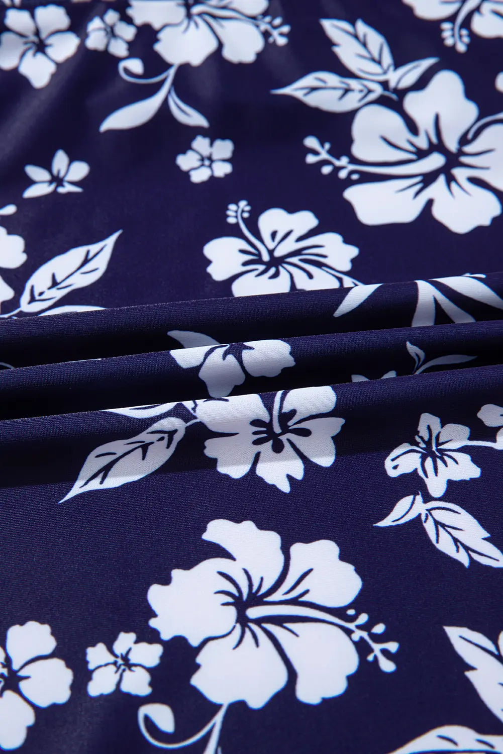 Navy blue fabric with white floral pattern