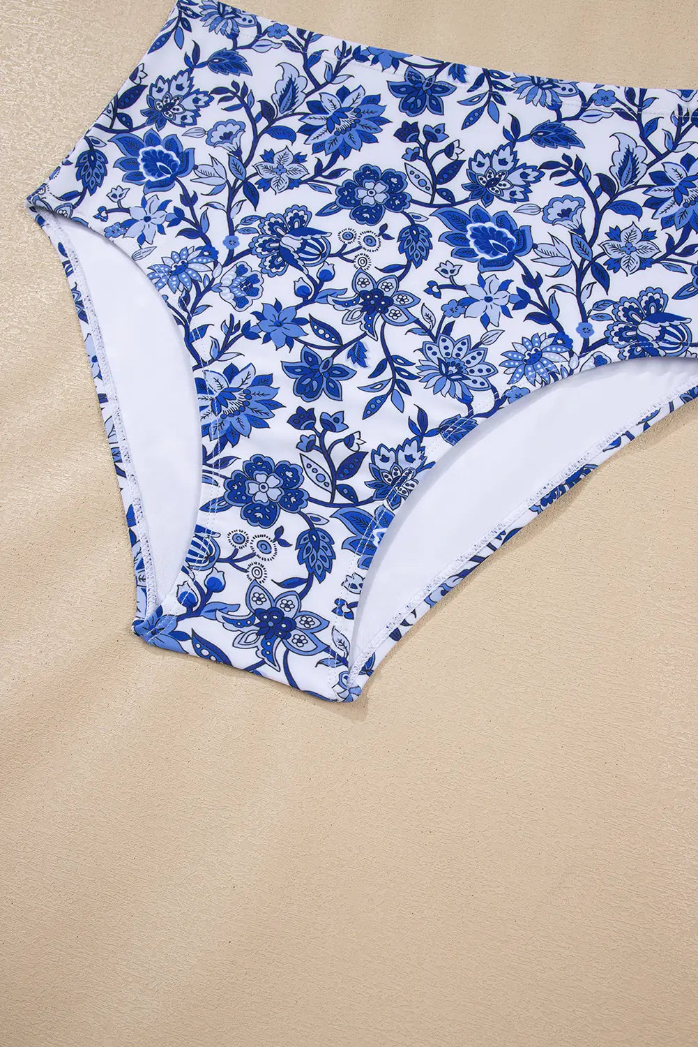 Blue floral patterned underwear on a beige background