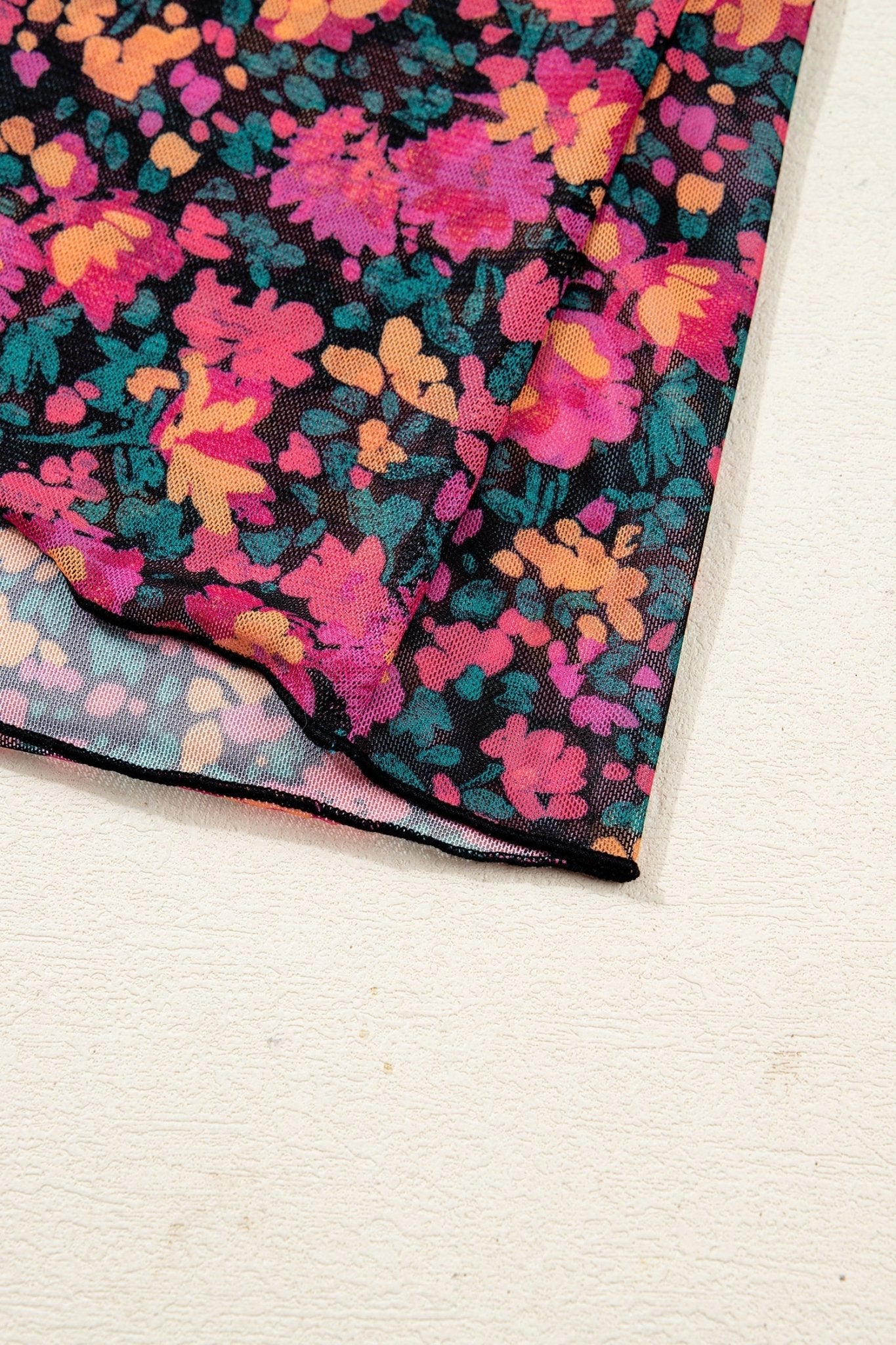 Colorful floral patterned fabric on a white background