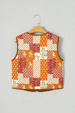 Sleeveless orange, red, and cream patchwork quilt vest