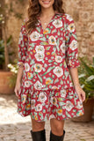 A woman wearing a red floral mini dress with three-quarter sleeves and a ruffled hem, paired with black boots, standing in front of a rustic stone wall and potted plants.