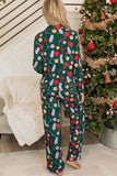 Woman in green holiday pajamas with colorful ornaments and snowflake print.
