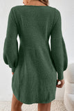 Green knitted dress worn by a person on a white background