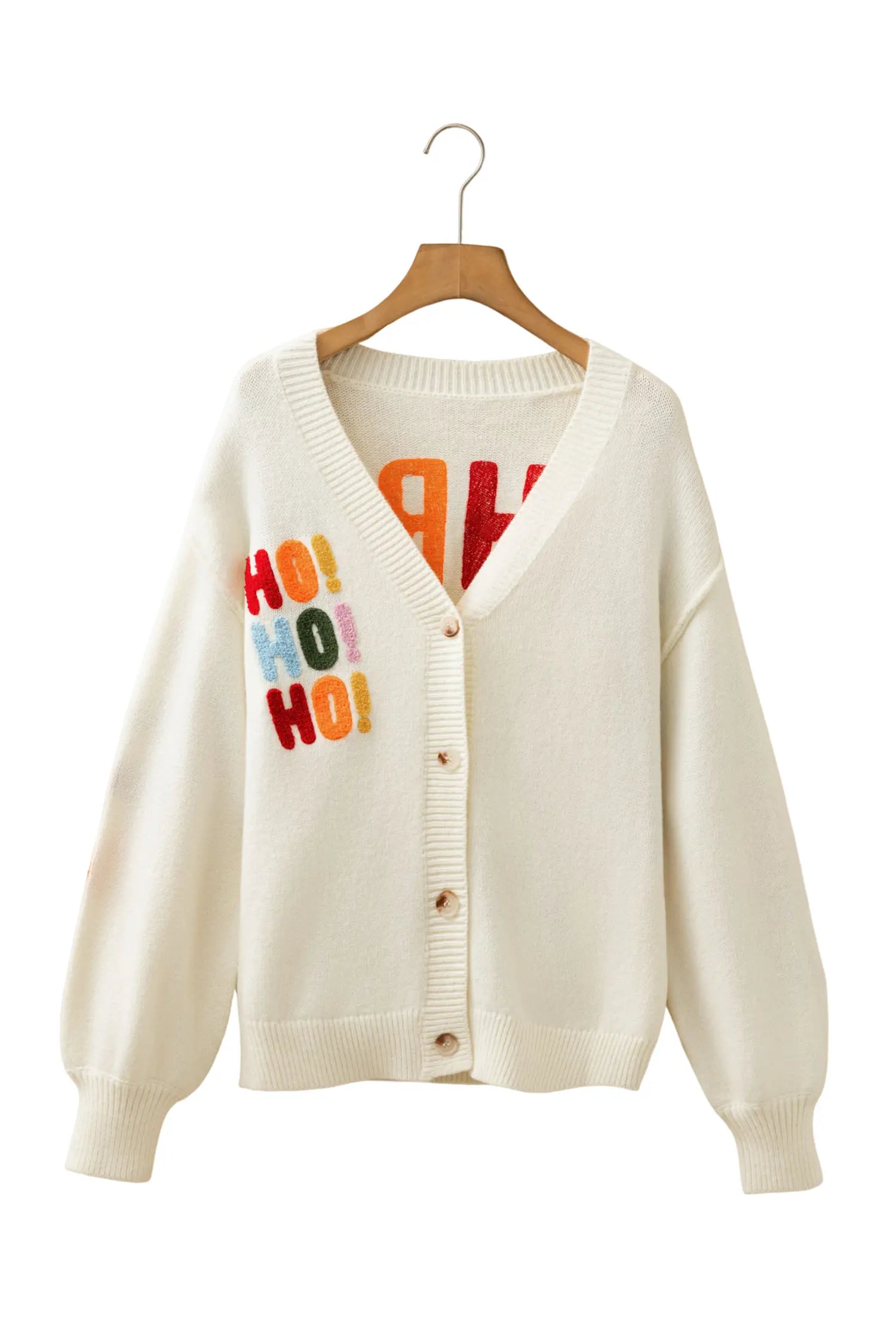 An off-white knit cardigan sweater with colorful 'HO! HO! HO!' text on the left chest, hanging on a wooden hanger against a plain white background.
