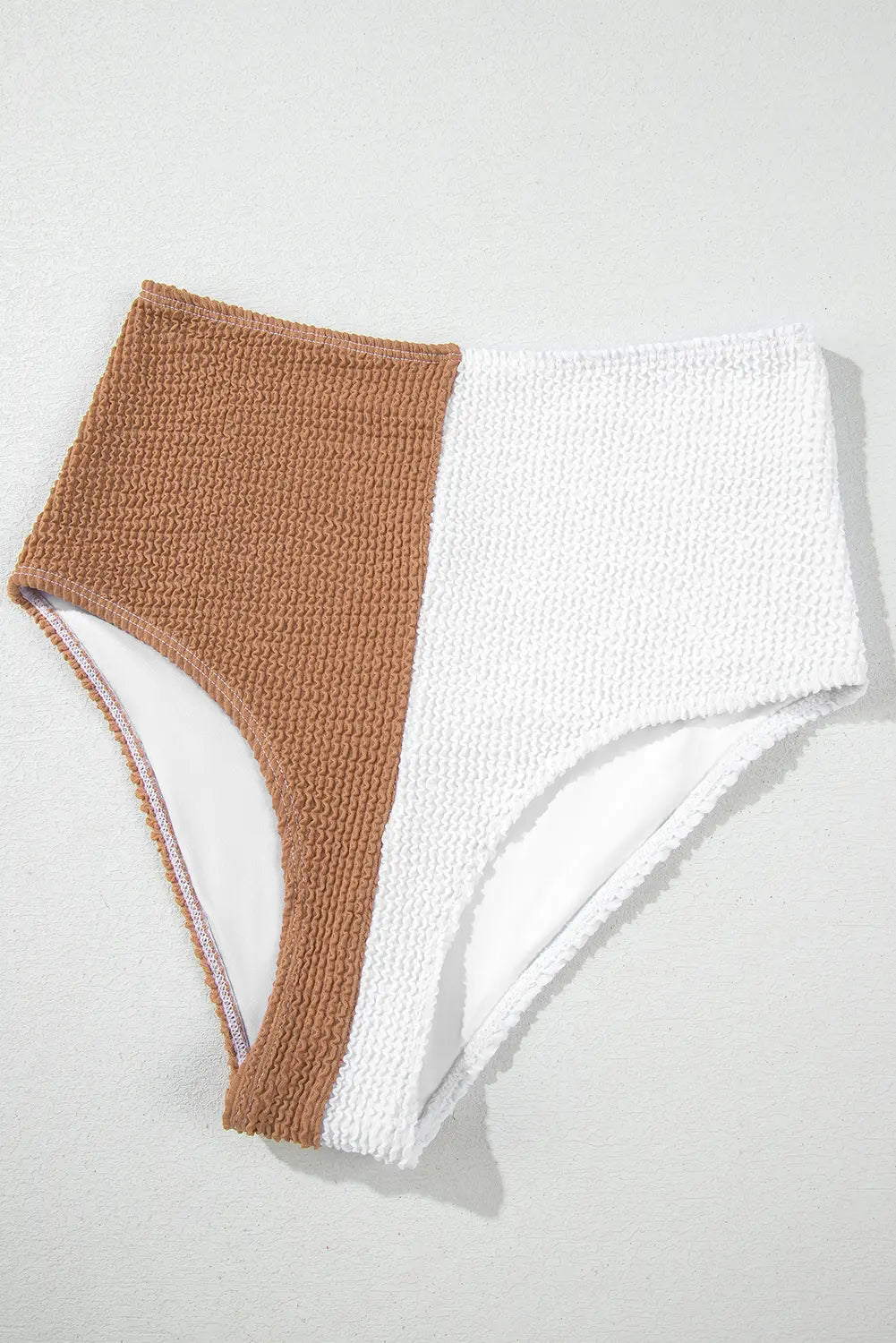 Brown and white textured fabric on a light gray background
