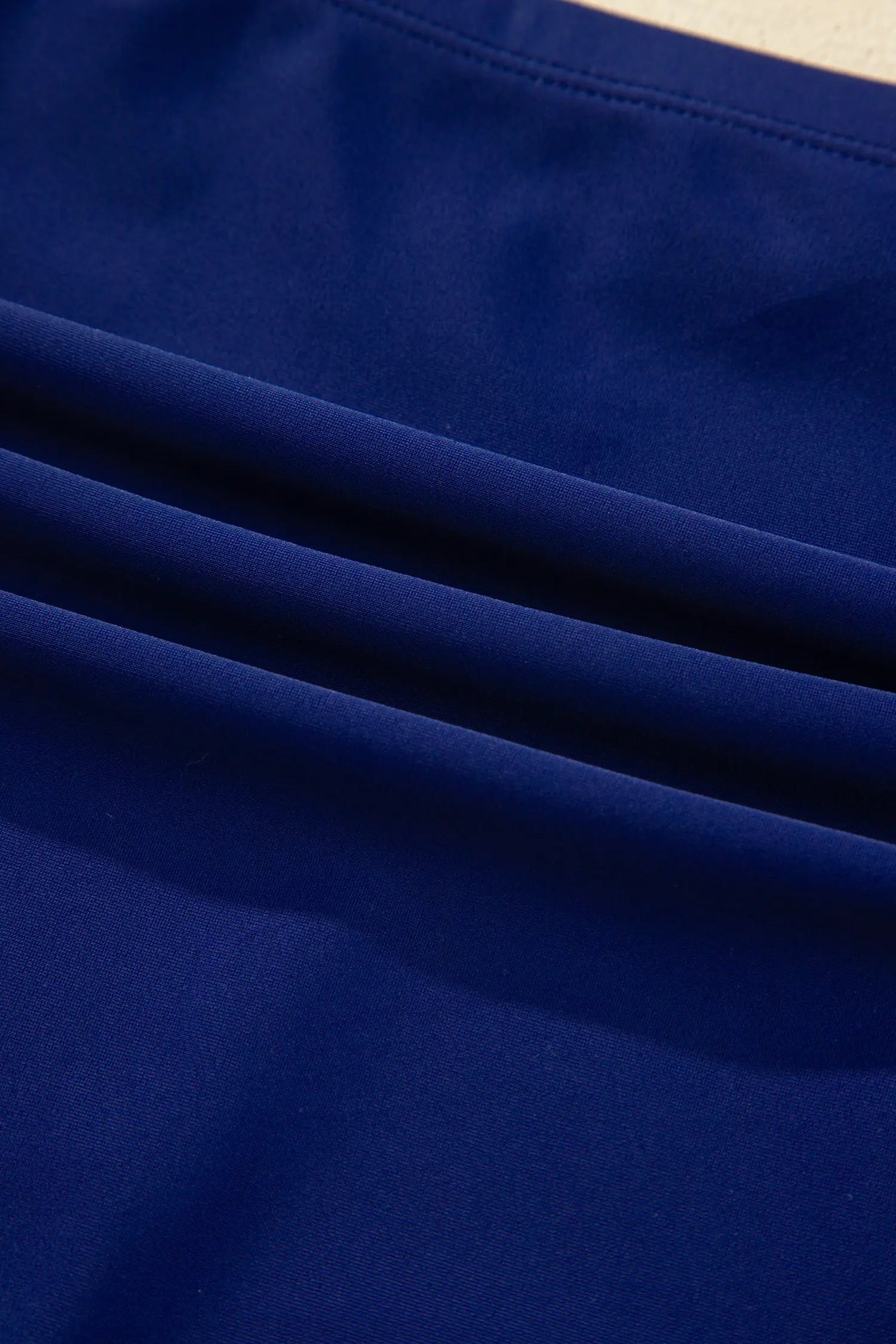 Close-up of blue fabric with folds