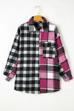 Plaid shirt with black, white, and pink pattern on a hanger against a white background