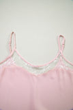 Pink lace-trimmed top on a light gray background
