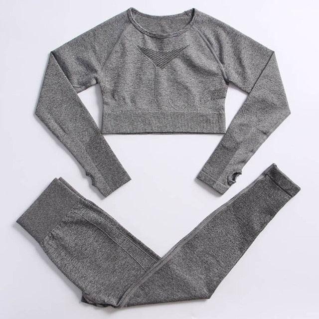 Gray long-sleeve crop top and leggings set on a light gray background