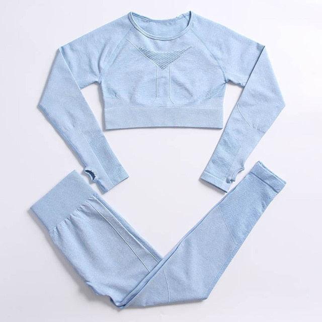 Light blue athletic crop top and leggings set on a white background