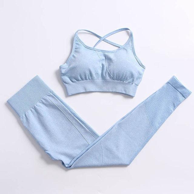 Light blue sports bra and leggings set on a light gray background