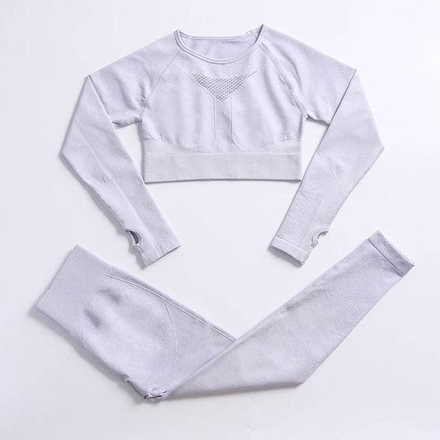 Gray long-sleeve crop top and leggings set on a light gray background