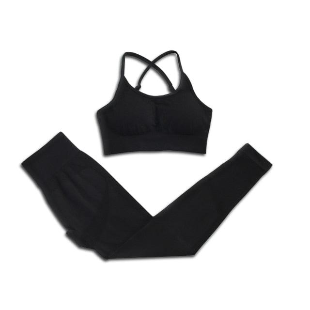 Black sports bra and leggings set on a white background