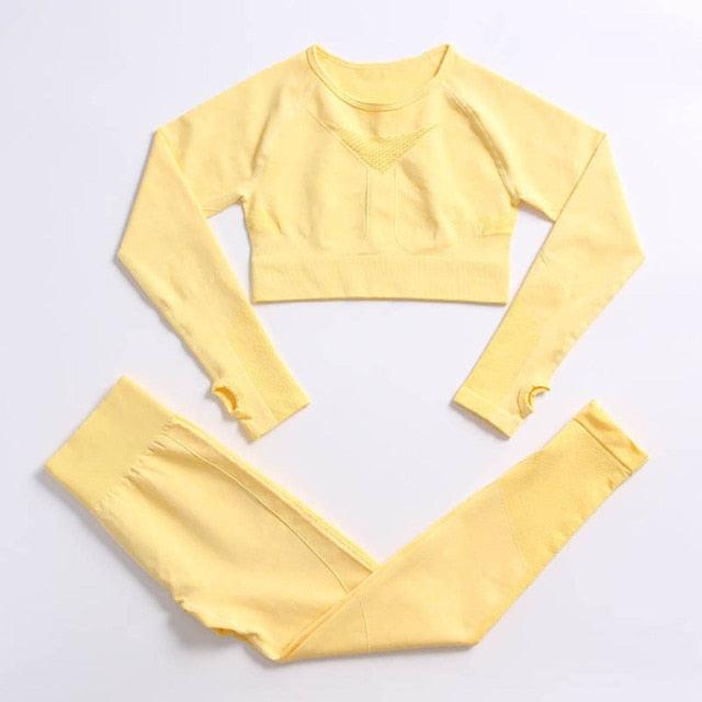 Yellow long-sleeve crop top and leggings set on a light gray background