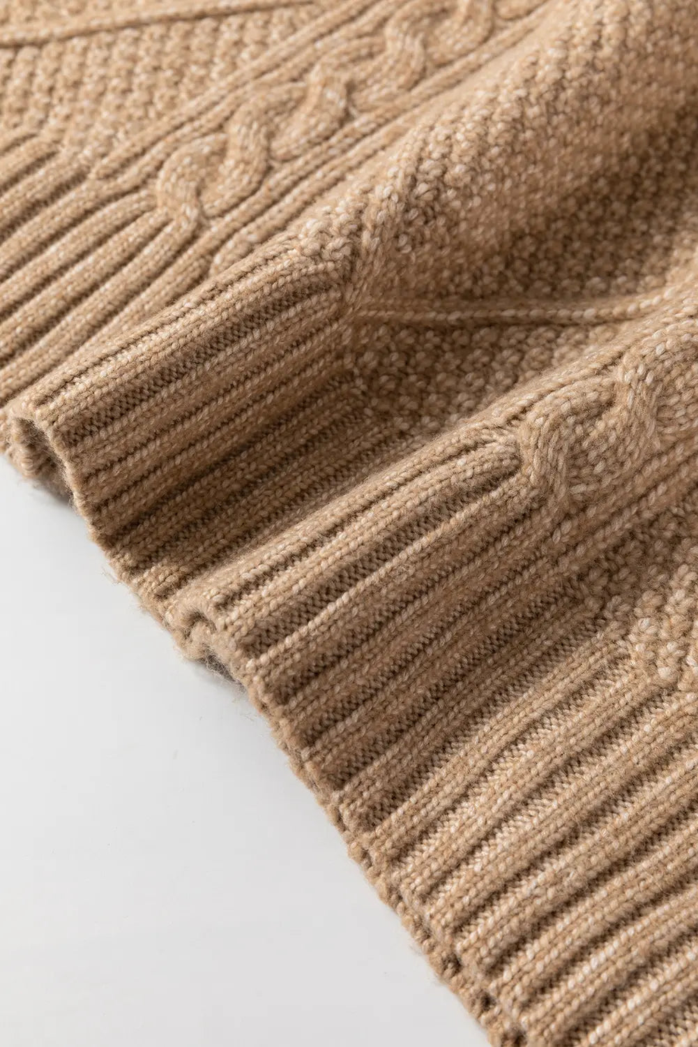 Close-up of a brown textured fabric on a light gray background