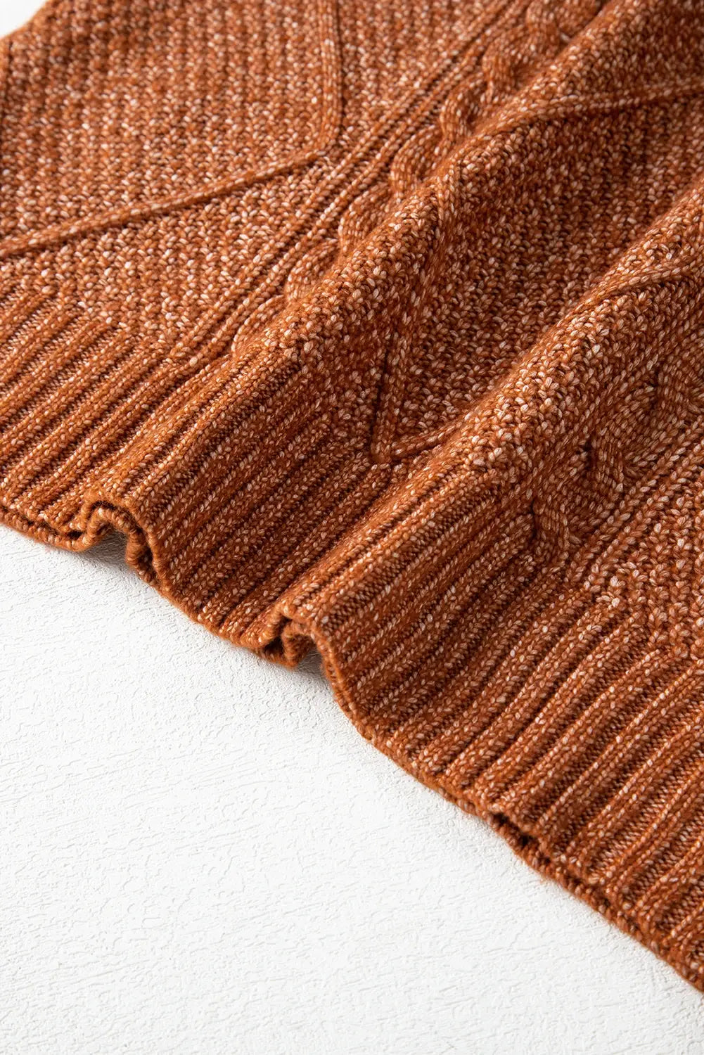 Close-up of brown textured fabric on a white background
