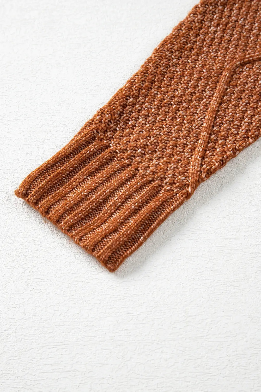 Brown knitted sleeve on a white background