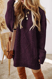 Person wearing a purple cable knit cardigan with a neutral background