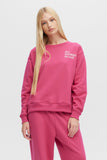 Woman wearing a pink sweatshirt with text on a white background