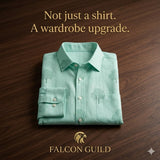 Folded light blue shirt with tree pattern on a wooden surface, Falcon Guild logo visible
