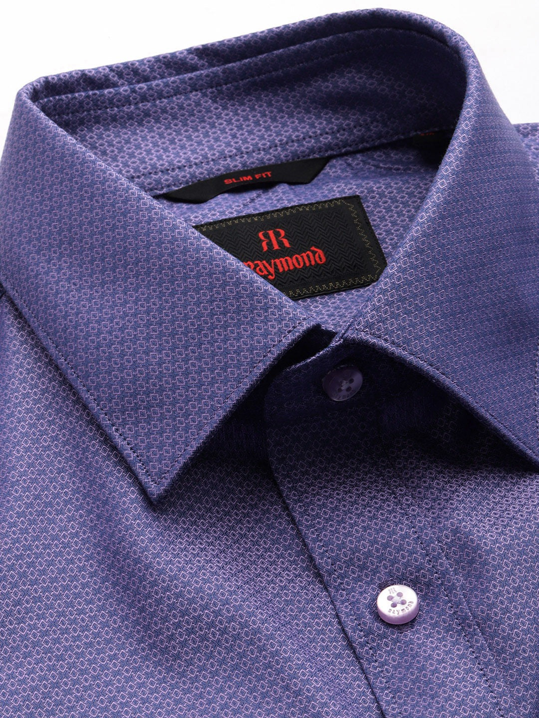 Close-up of a blue dress shirt with a visible Raymond label.