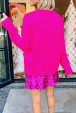 Back view of woman in hot pink sweater and matching sequin mini skirt.
