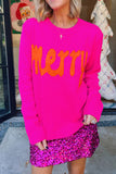 Woman in hot pink “Merry” sequin sweater with matching mini skirt.