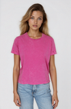 Woman wearing a pink t-shirt and blue jeans on a white background
