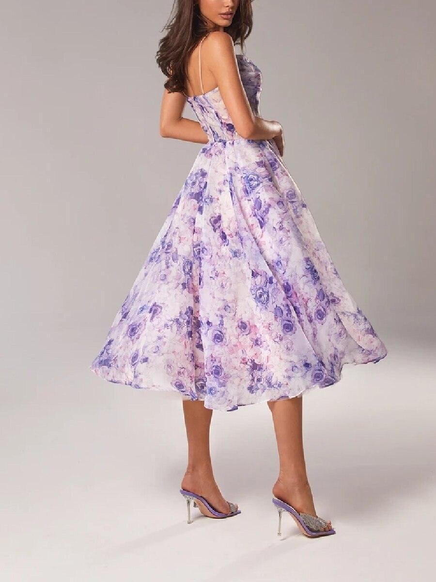 Woman wearing a floral dress with a gray background
