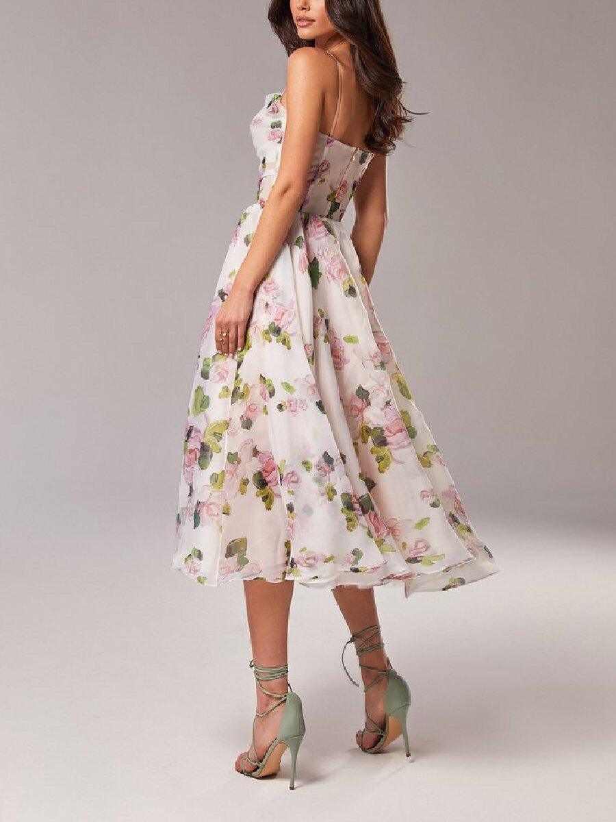 Woman wearing a floral dress on a plain background