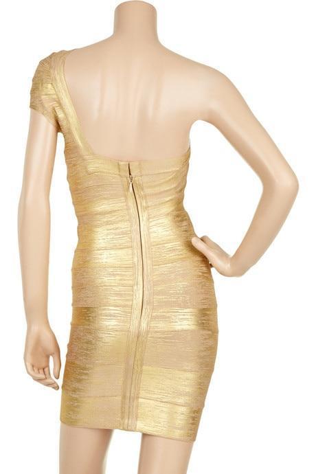 Gold dress on a mannequin with a plain background