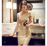 Woman in a gold dress holding a Dior product in a bathroom setting