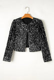 Black sequin jacket on a hanger against a white background
