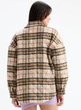 Person wearing a plaid shirt on a white background