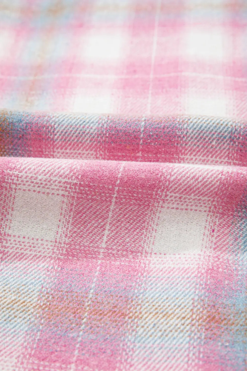 Close-up of a fabric with pink and white plaid pattern