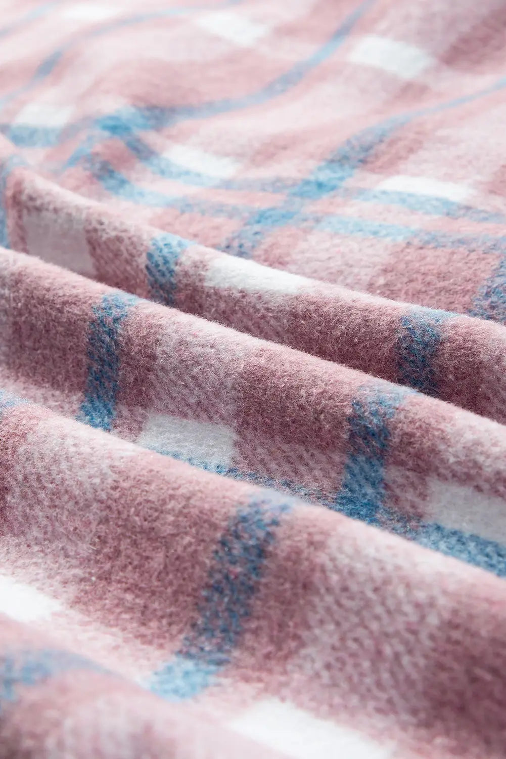 Close-up of a pink and blue checkered fabric texture