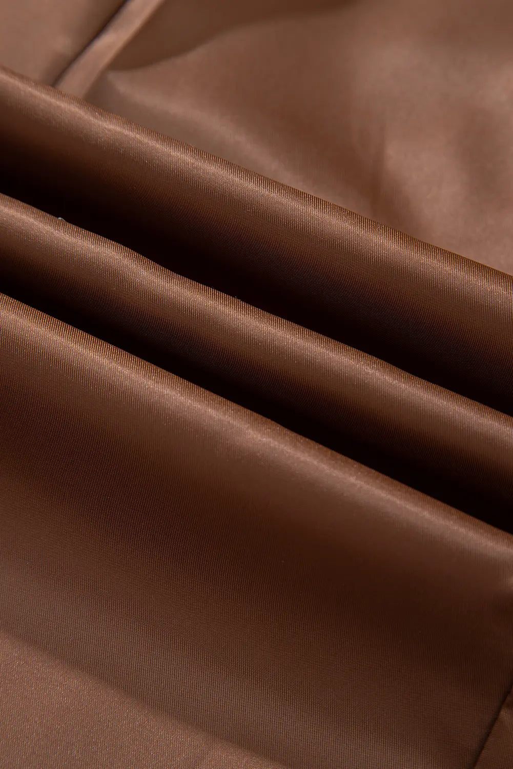 Close-up of brown leather fabric with visible texture