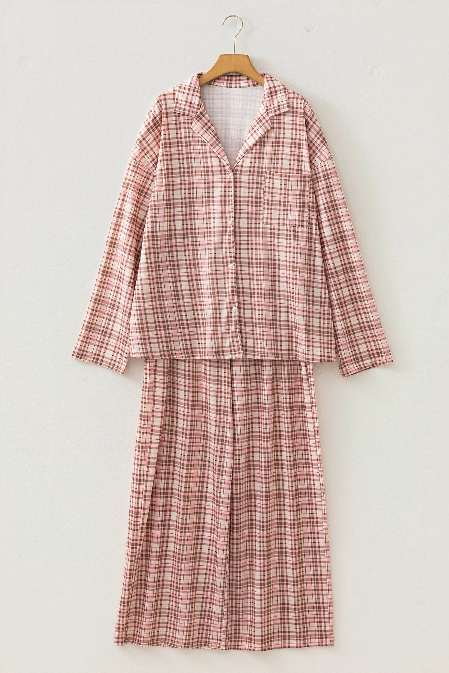 Dusty pink and red plaid pajama set with a long skirt on a hanger.