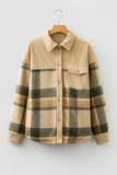 Beige plaid shirt on a hanger against a white background