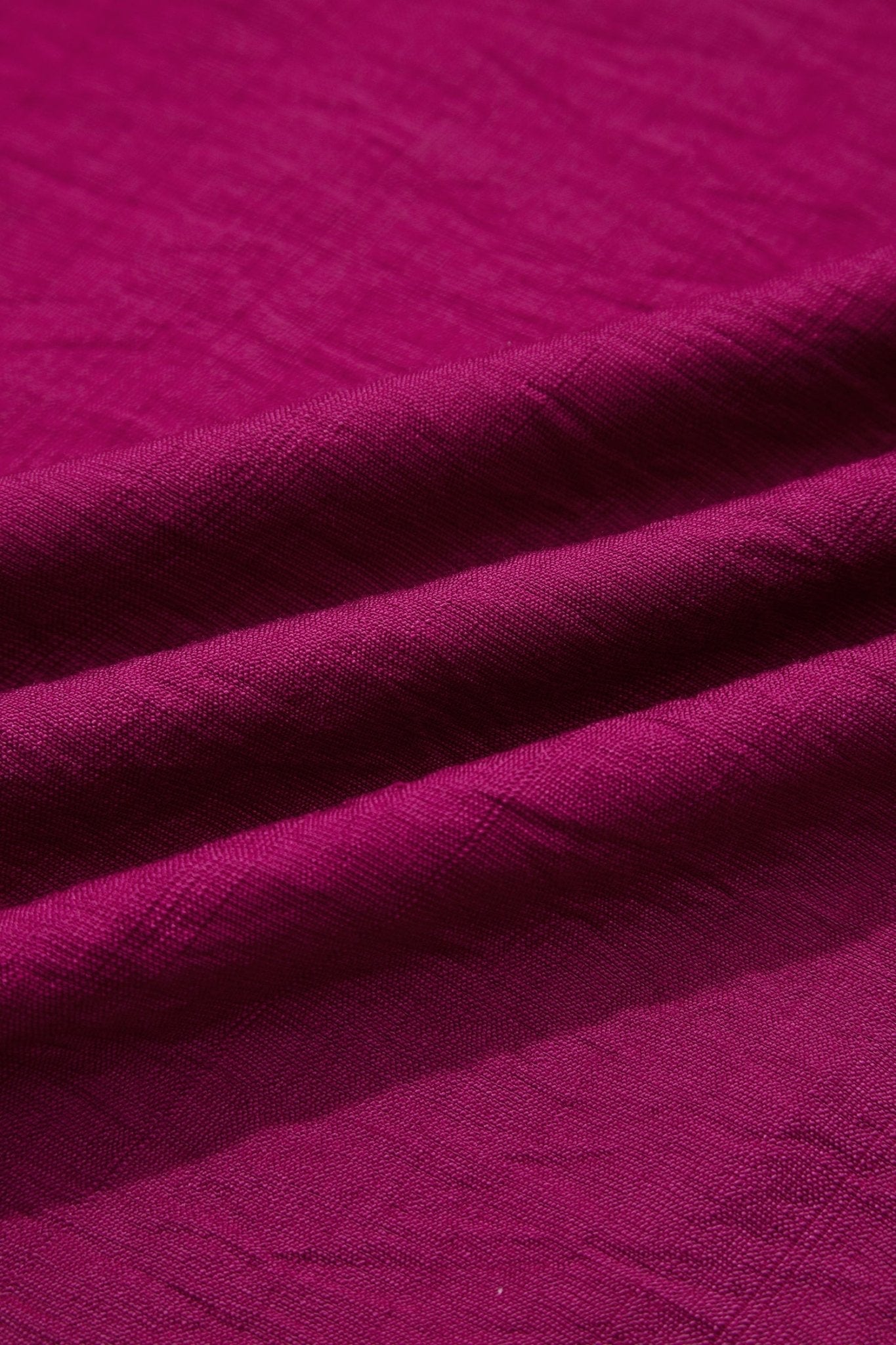 Close-up of purple fabric with a textured pattern