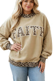 Woman wearing a beige sweatshirt with leopard trim and “FAITH” leopard print lettering.